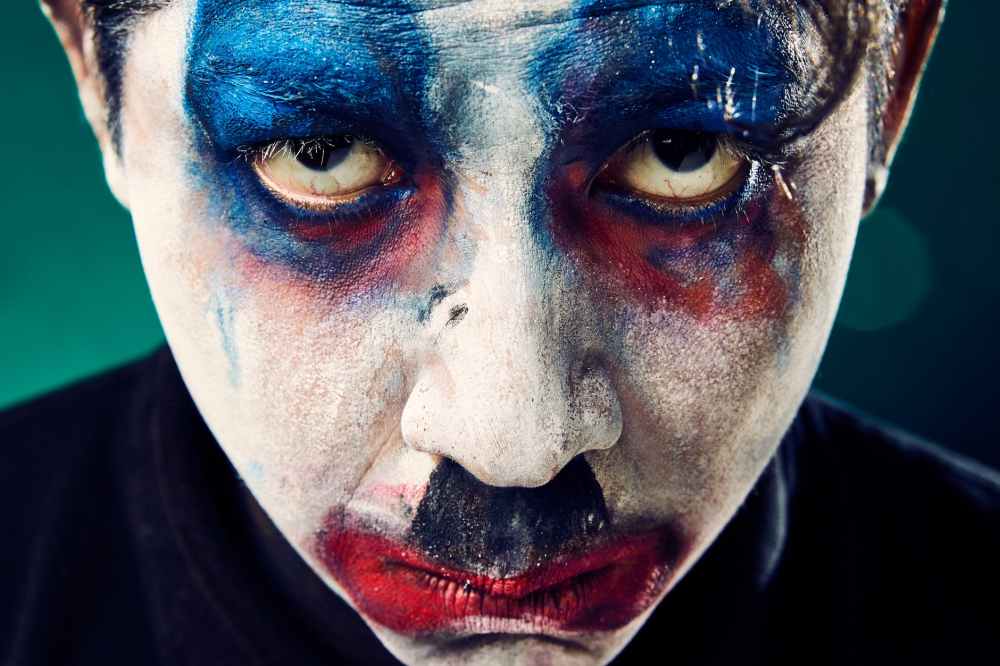 man with face make up